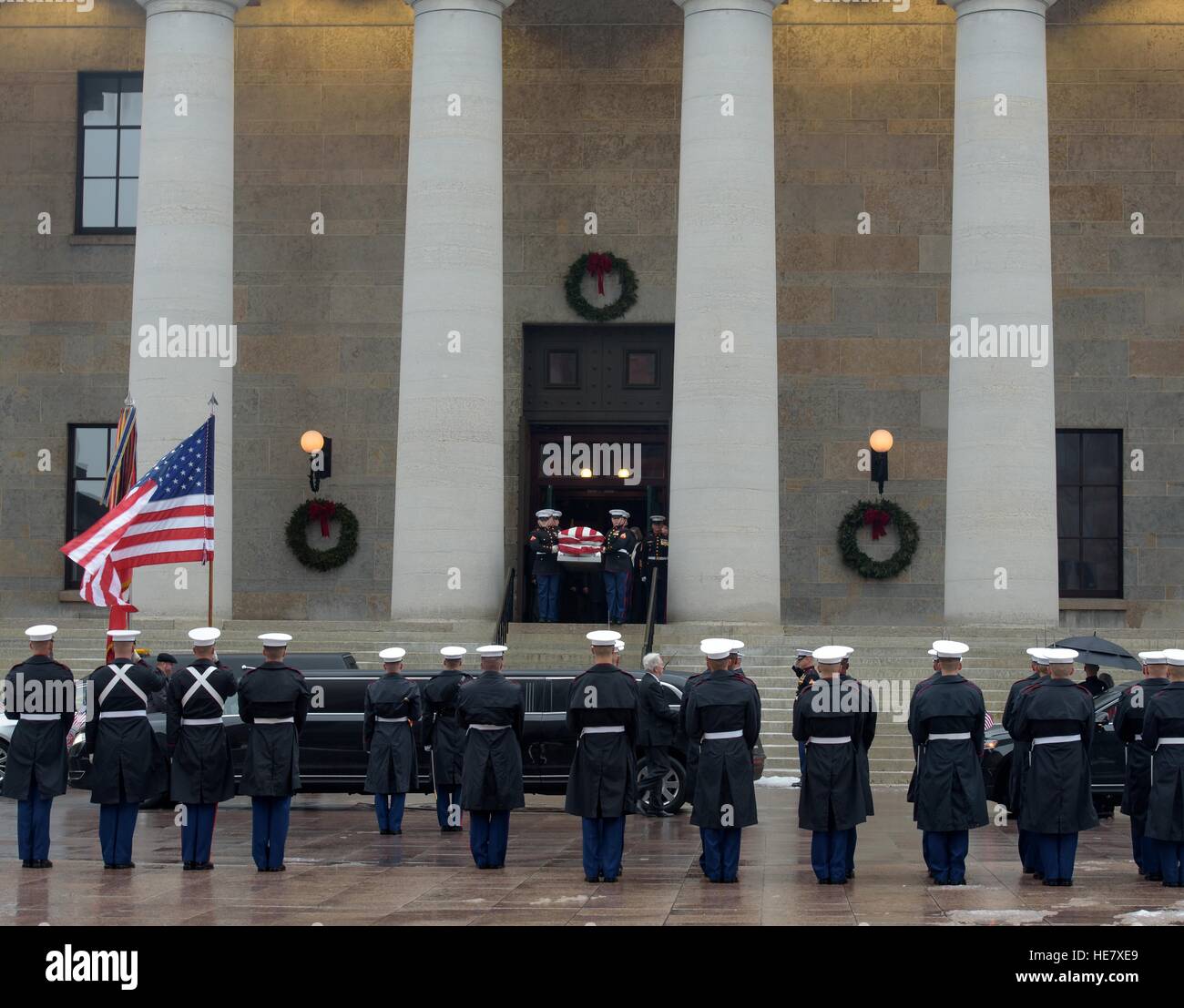 U.S. Marine Corps honor guard escort the casket of astronaut and former Senator John Glenn from the Ohio Statehouse during the funeral procession December 17, 2016 in Columbus, Ohio. The former Marine pilot, Senator and first man to orbit the earth died last week at the age of 95. Stock Photo