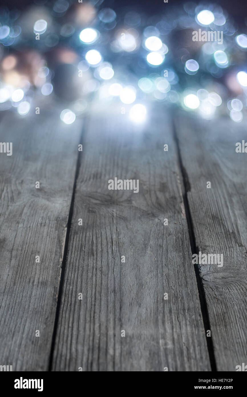 Blured christmas lights on wooden planks. Copyspace background Stock ...