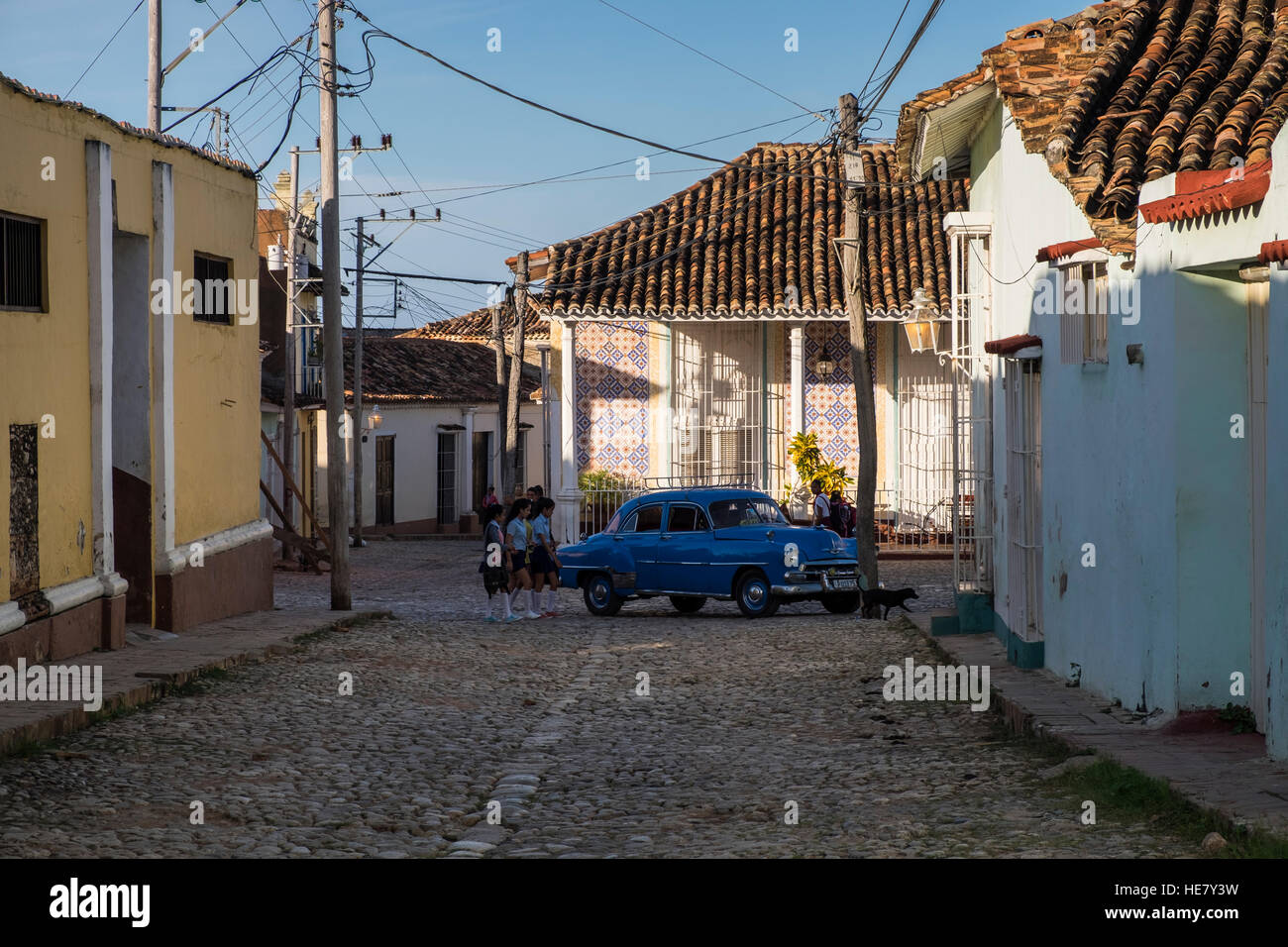 Blue car, american classic 1950s Chevrolet, taxi, crossing junction in Trinidad, Cuba Stock Photo