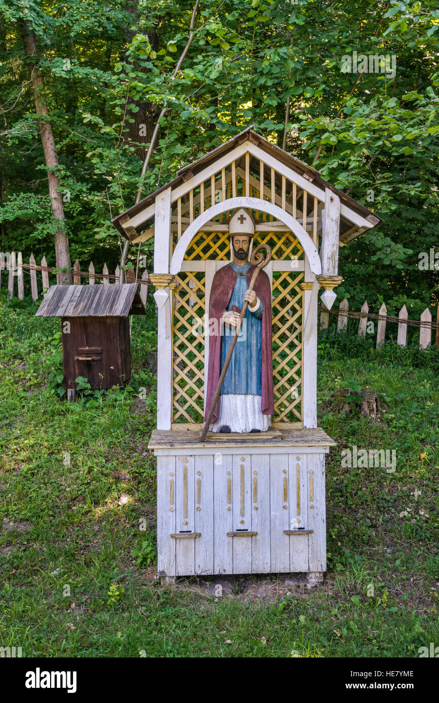 Beehive with statue of bishop, apiary, Pogorzanie (Polish Uplanders) ethnic group, Rural Architecture Museum in Sanok, Malopolska, Poland Stock Photo