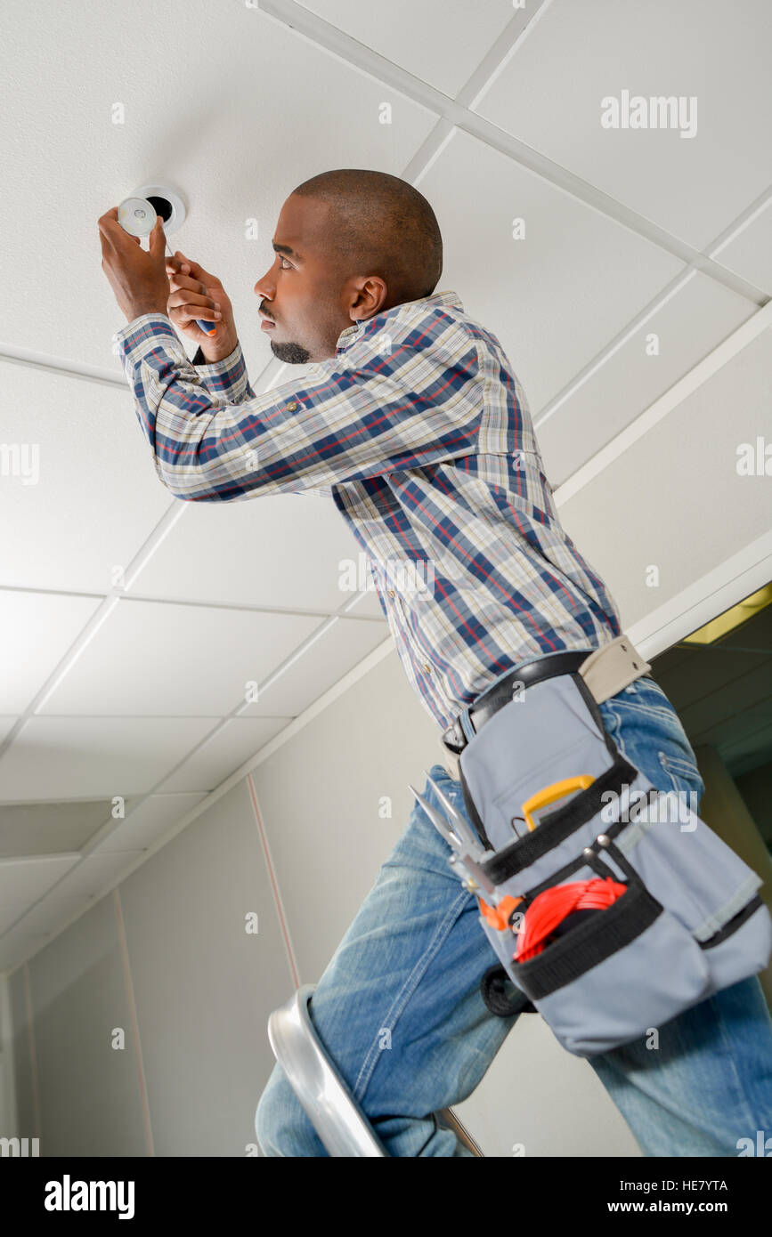 Replacing a ceiling bulb Stock Photo - Alamy