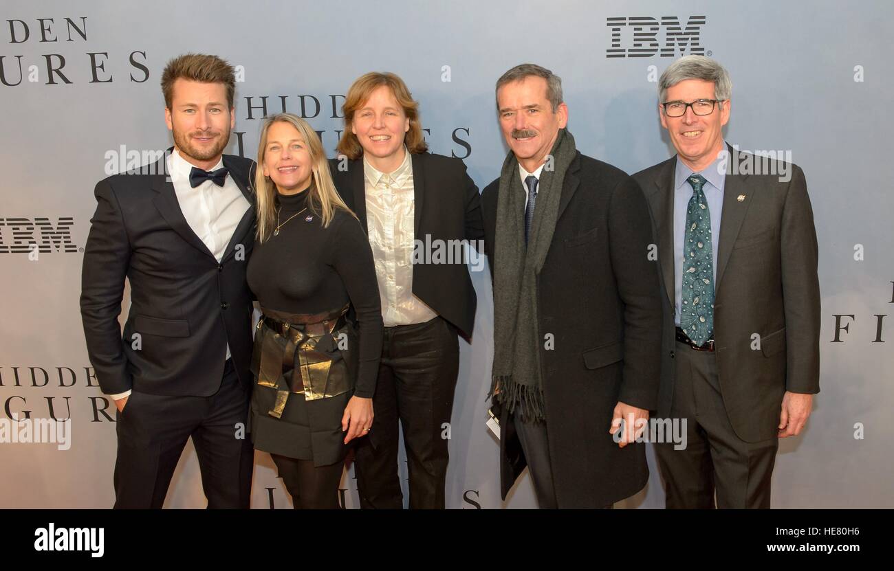 Actor Glen Powell (left), NASA Deputy Administrator Dava Newman, U.S. Chief Technology Officer Megan Smith, Canadian astronaut Chris Hadfield, and NASA Chief Historian Bill Barry walk the red carpet during the global celebration event for the film Hidden Figures at the SVA Theatre December 10, 2016 in New York City, New York. The film is based on the true story of the African-American women who worked as human computers during the Friendship 7 mission in 1962. Stock Photo