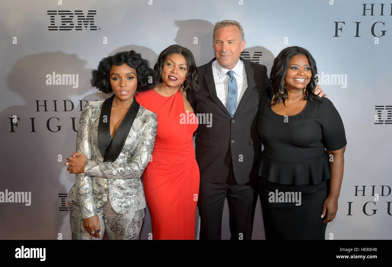 Musician Janelle Monae (left), actress Taraji P. Henson, actor Kevin Costner, and actress Octavia Spencer walk the red carpet during the global celebration event for the film Hidden Figures at the SVA Theatre December 10, 2016 in New York City, New York. The film is based on the true story of the African-American women who worked as human computers during the Friendship 7 mission in 1962. Stock Photo