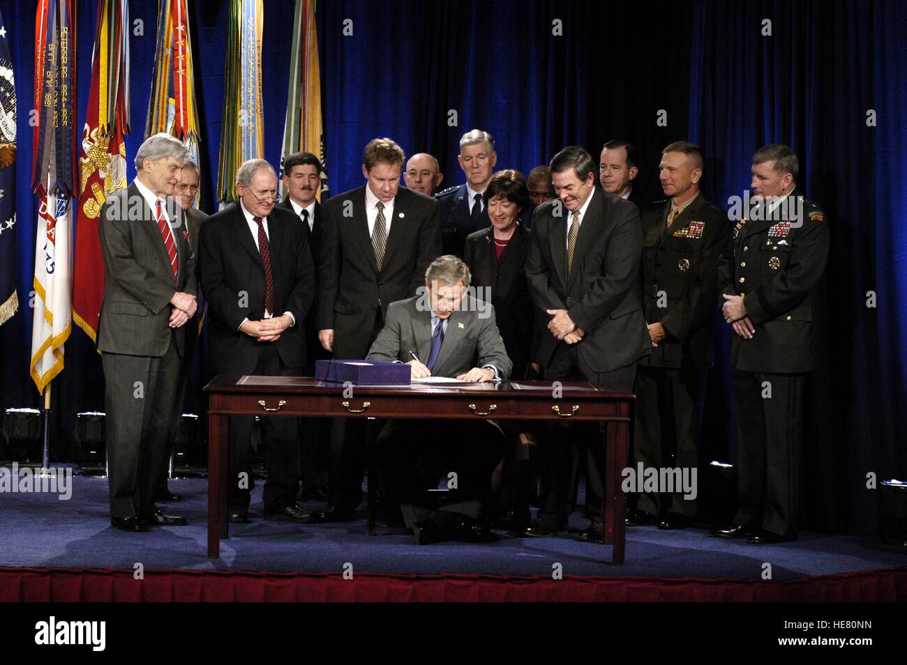 U.S. President George W. Bush signs the Defense Authorization Bill at ...