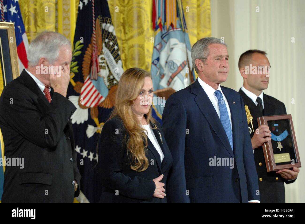 U.S. President George W. Bush presents the Medal of Honor to the parents of Navy SEAL Michael Murphy, Daniel Murphy and Maureen Murphy, during a ceremony at the White House October 22, 2007 in Washington, DC. Murphy was killed by enemy fire while serving near Asadabad, Afghanistan. Stock Photo