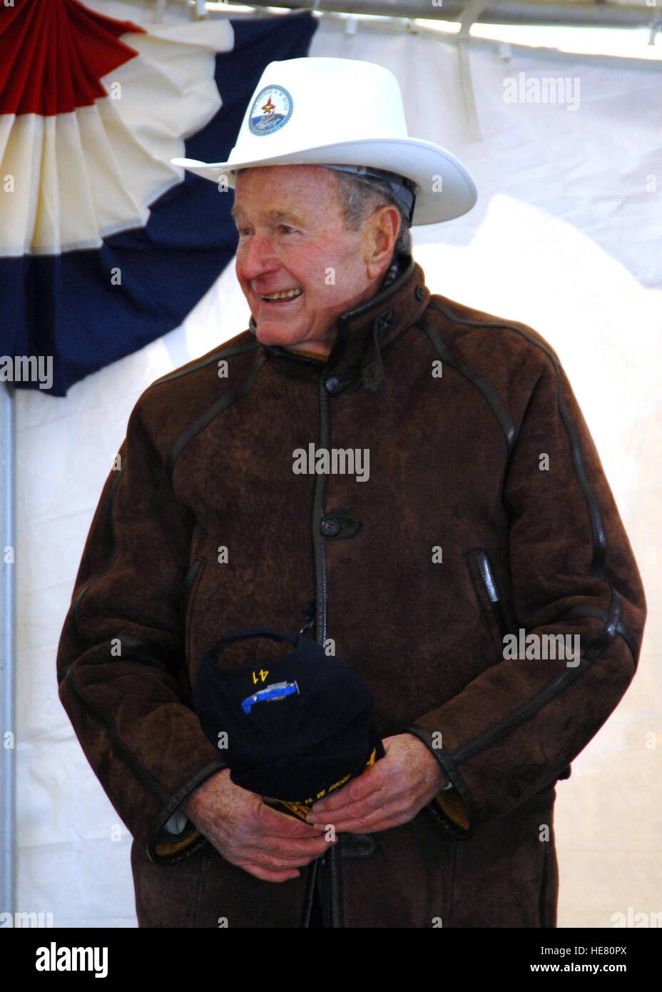 former-us-president-george-hw-bush-wears-a-cowboy-style-hard-hat-while-HE80PX.jpg