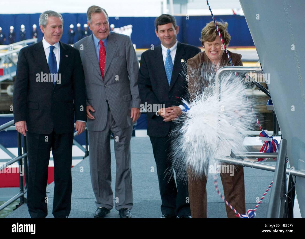 From left to right, U.S. President George W. Bush, former President George H.W. Bush, Northrop Grumman Newport News President Mike Petters, and ship sponsor Dorothy Bush Koch christen the USN Nimitz-class aircraft carrier USS George H.W. Bush at the Northrop Grumman Newport News Shipyard October 7, 2006 in Newport News, Virginia. Stock Photo