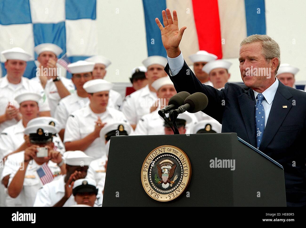 U.S. President George W. Bush waves to U.S. soldiers during an event commemorating the 60th anniversary of Victory over Japan Day at the Naval Air Station North Island August 30, 2005 in Coronado, California. Stock Photo