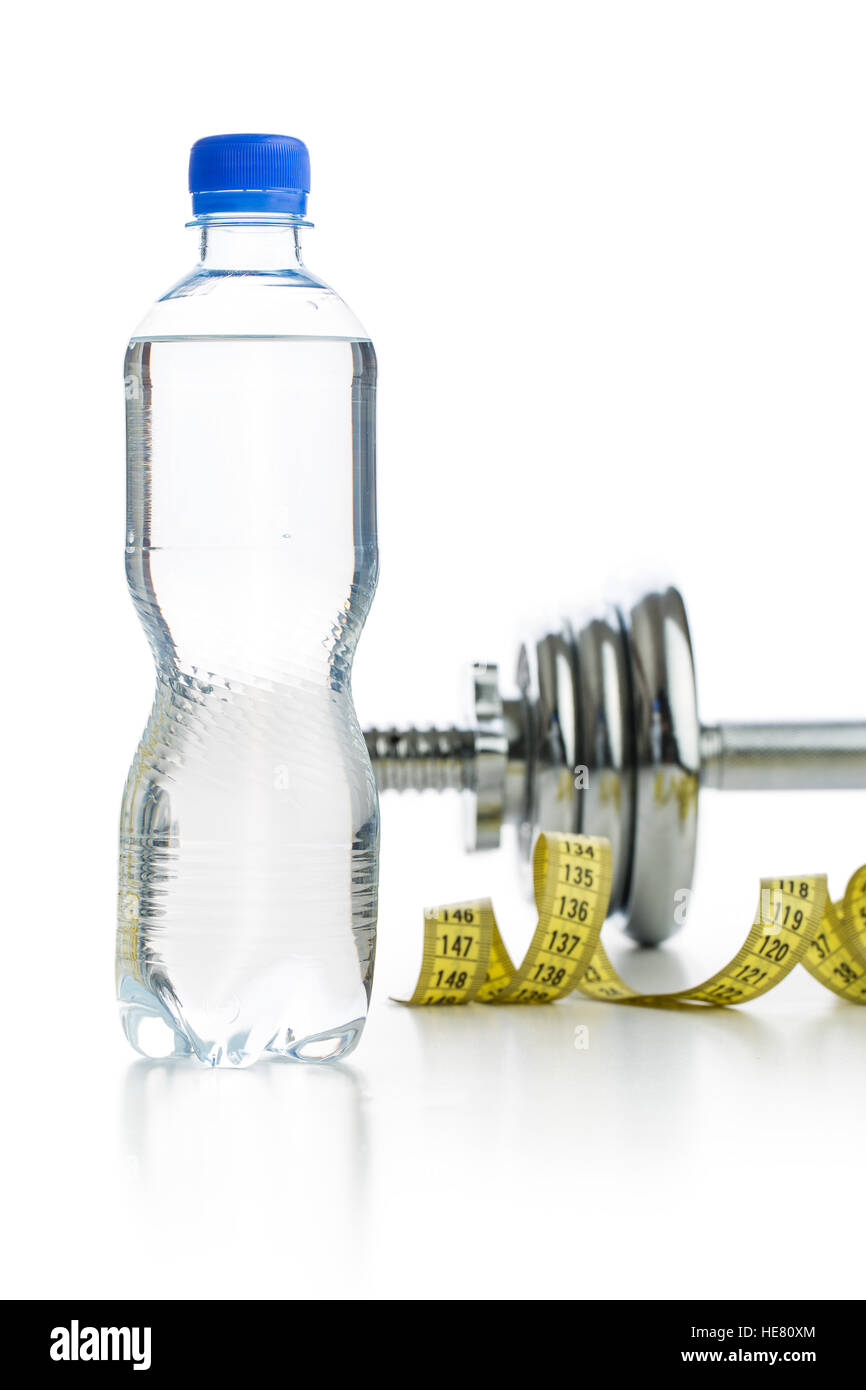 Bottle water and dumbbell isolated on white background. Stock Photo