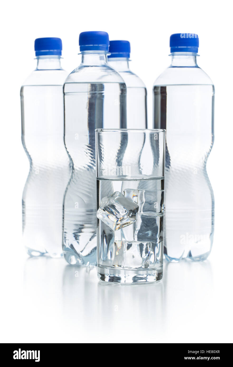 Glass of pure water with ice cubes and bottle water. Stock Photo