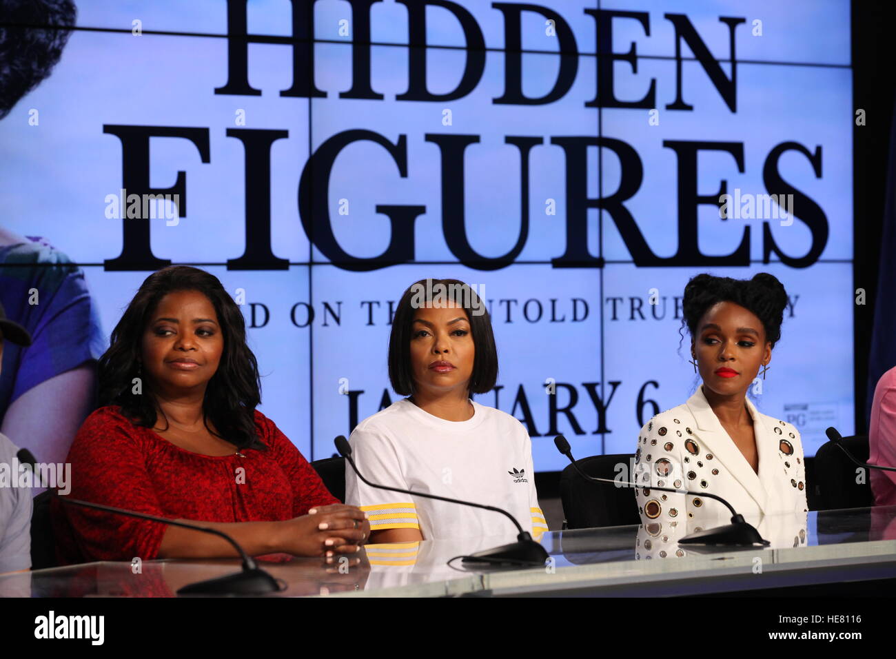 Hidden Figures actresses (L-R) Octavia Spencer, Taraji P. Henson, and Janelle Monae speak to the media during a news conference for the film at the Kennedy Space Center Press Site Auditorium December 12, 2016 in Merritt Island, Florida. The film is based on the African-American women who worked on the NASA Project Mercury missions in 1962. Stock Photo
