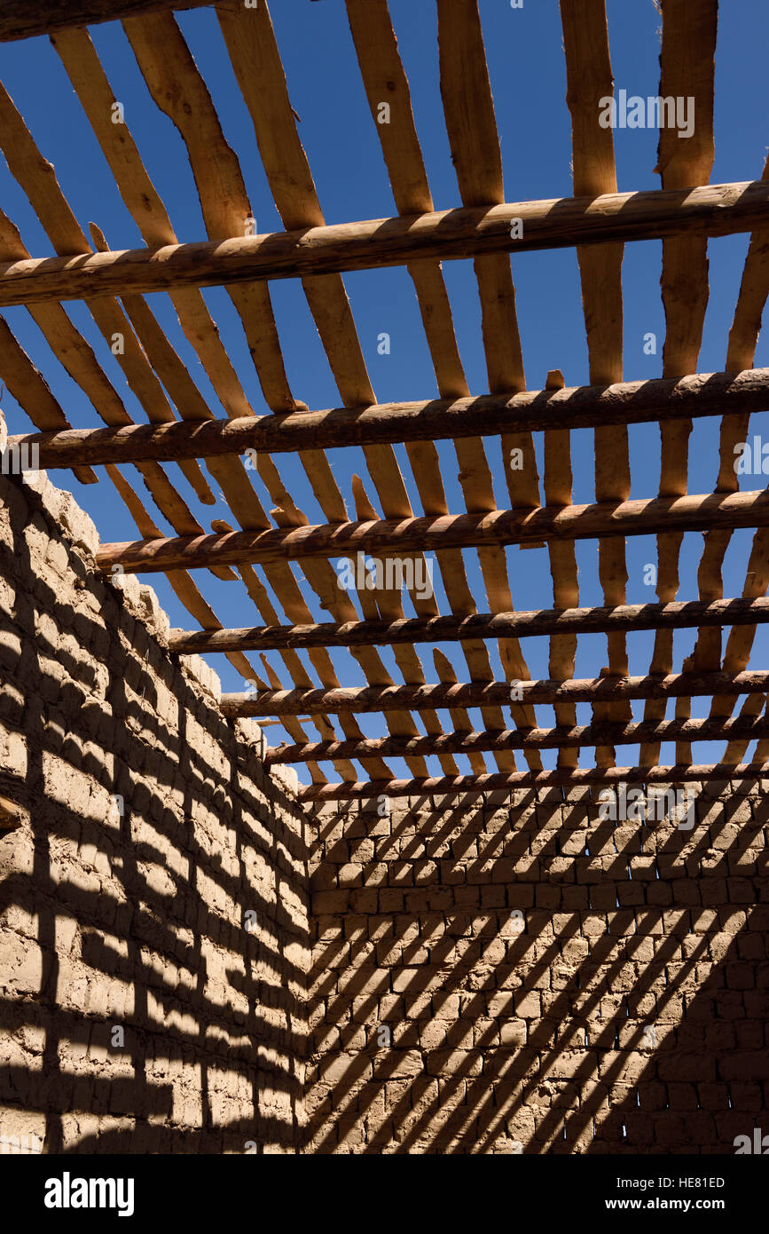 Shadows Of Timber Beams And Wood Ceiling Slats On Mud Brick