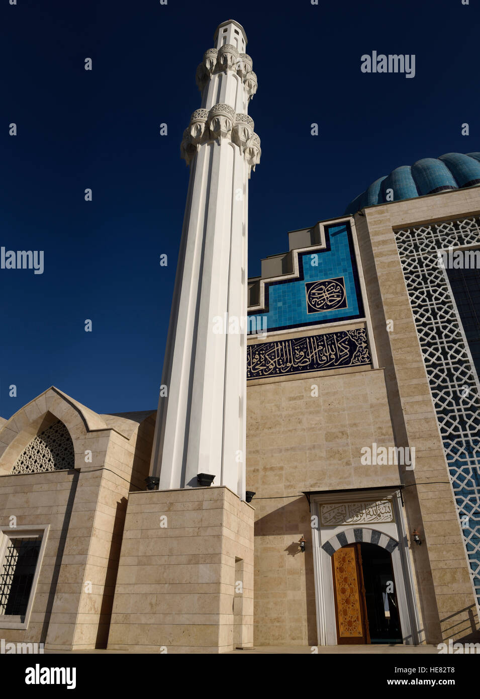 Blue sky and white minaret of Hoca Ahmet Yesevi Mosque in Turkistan Kazakhstan Stock Photo