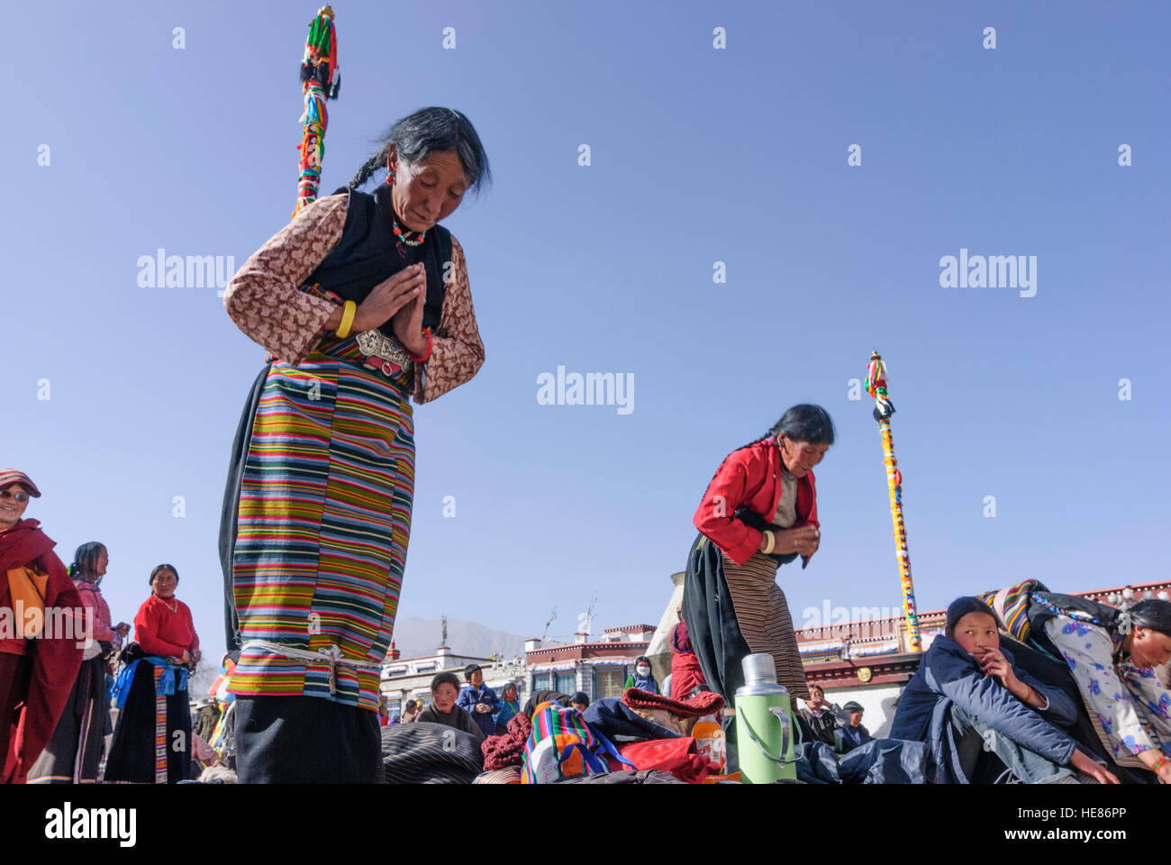 Lhasa Praying, prostrating Tibetans in front of Jokhang Temple, Tibet