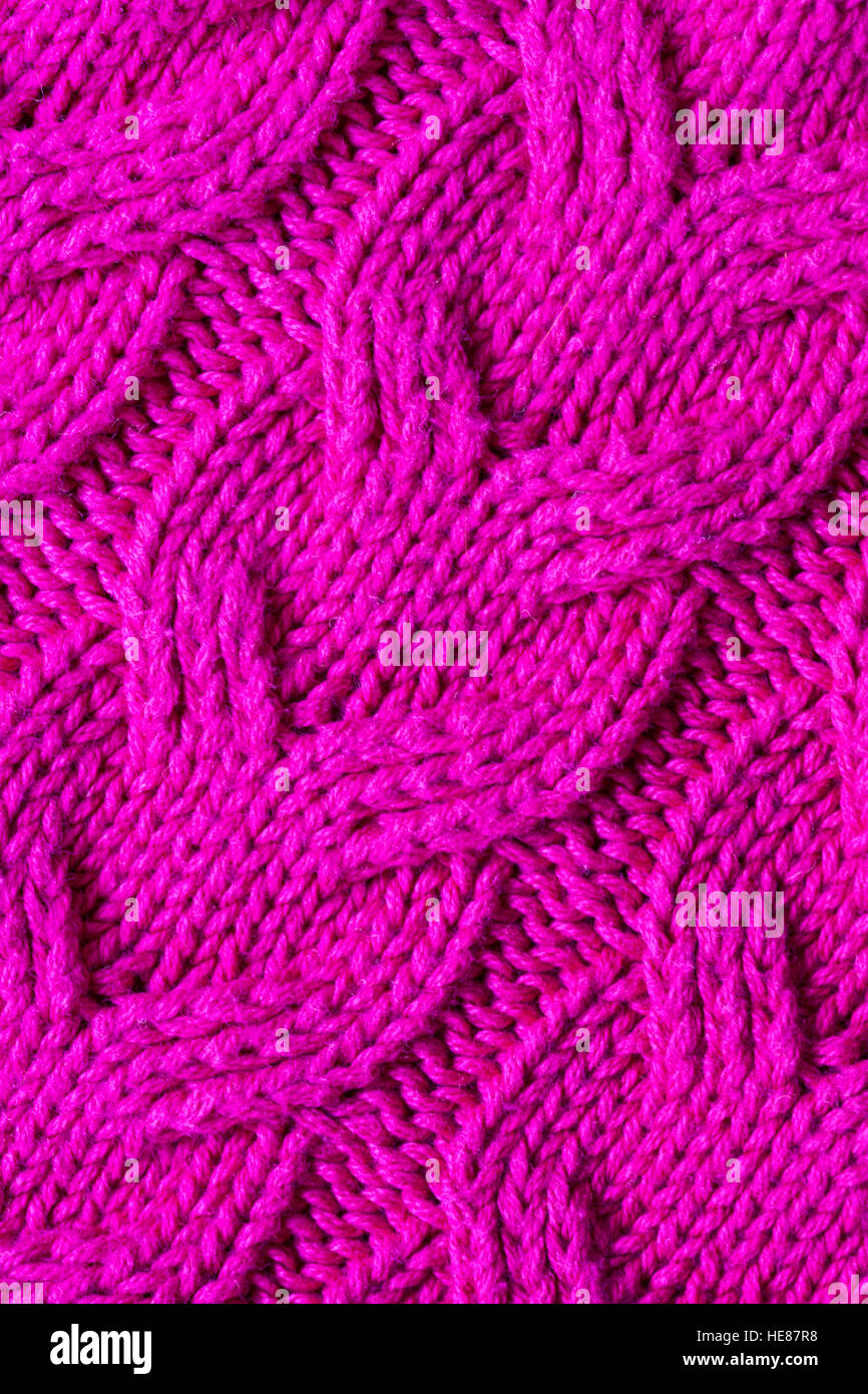 Detail of cable knitted pattern on pink jumper Stock Photo