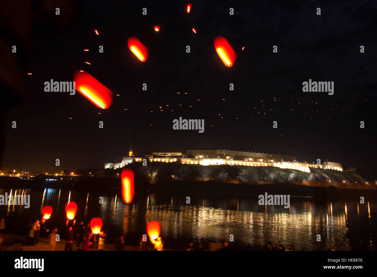 The release of Chinese wish lanterns over the Danube and the Petrovaradin fortress Stock Photo