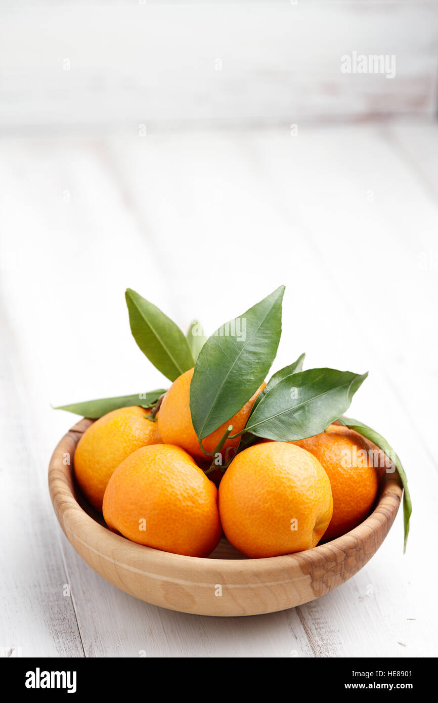 Fresh tangerines with leaves Stock Photo