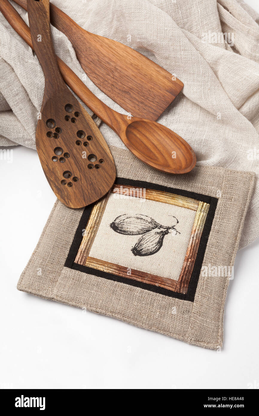 Image of kitchen equipment - wooden tools and patchwork potholder. Stock Photo