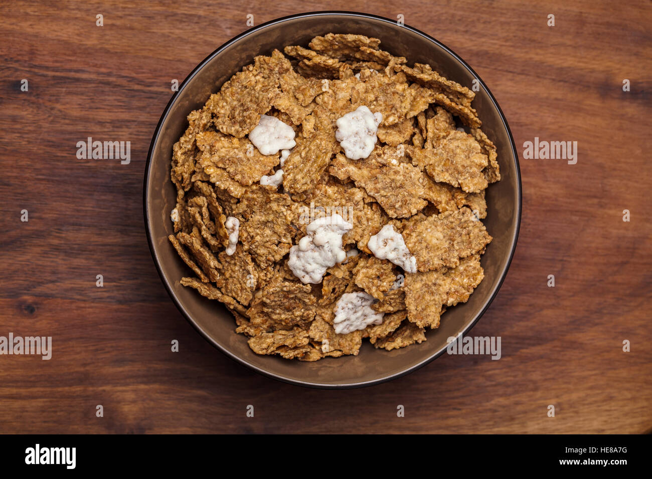 Image of bowl muesli on a wooden table. Stock Photo