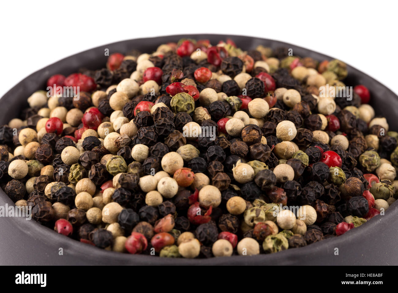bowl of various pepper peppercorns seeds mix on white Stock Photo Alamy