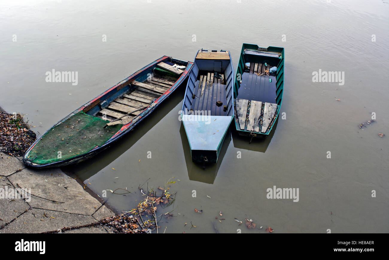 Three boats anchored along the coast are waiting to pull them out to the coast. Stock Photo