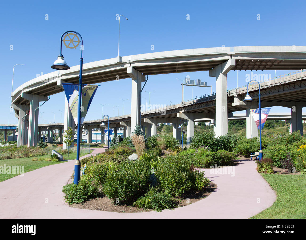 The curved park pathway under the road in Saint John town (New Brunswick, Canada). Stock Photo