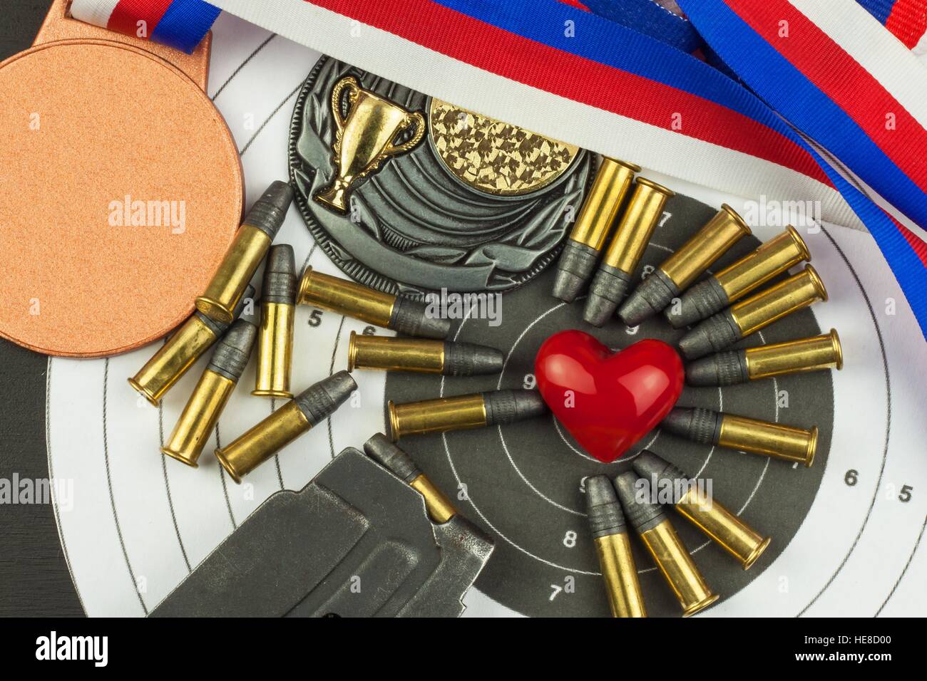 Shooting competition. Award winners. Biathlon victory. Ammunition and winners medals in biathlon