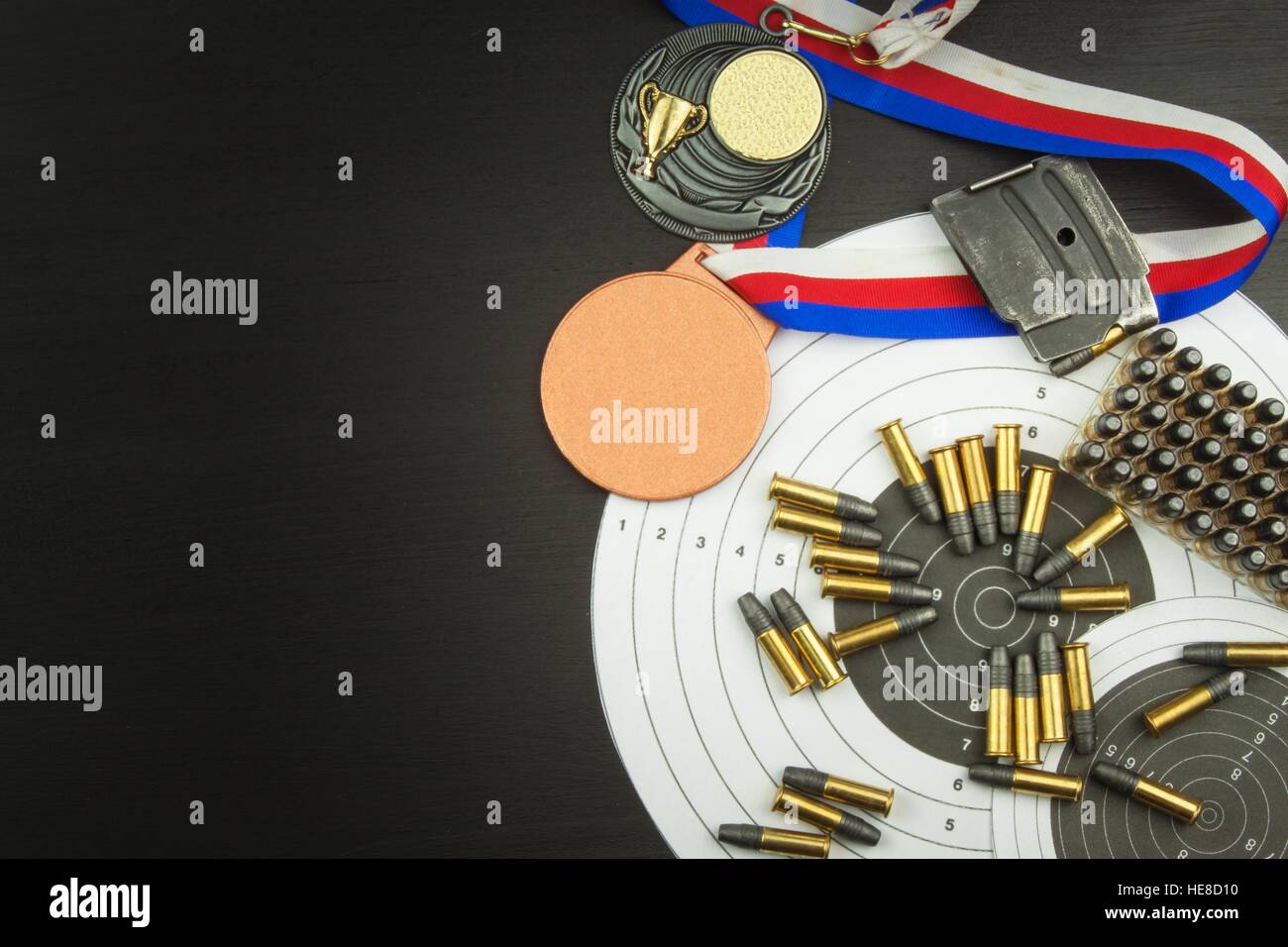 Shooting competition. Award winners. Biathlon victory. Ammunition and winners medals in biathlon