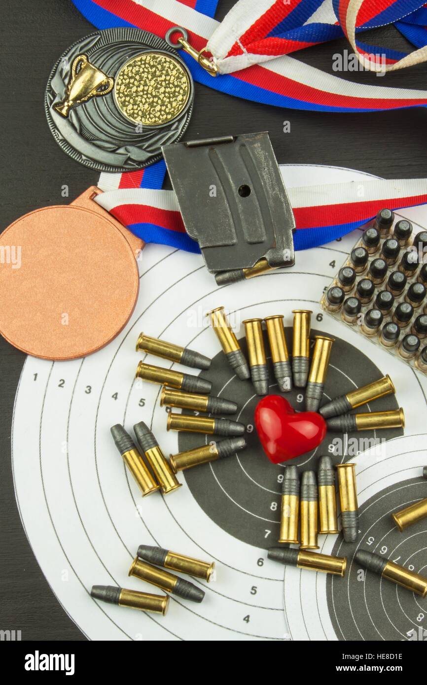 Shooting competition. Award winners. Biathlon victory. Ammunition and winners medals in biathlon