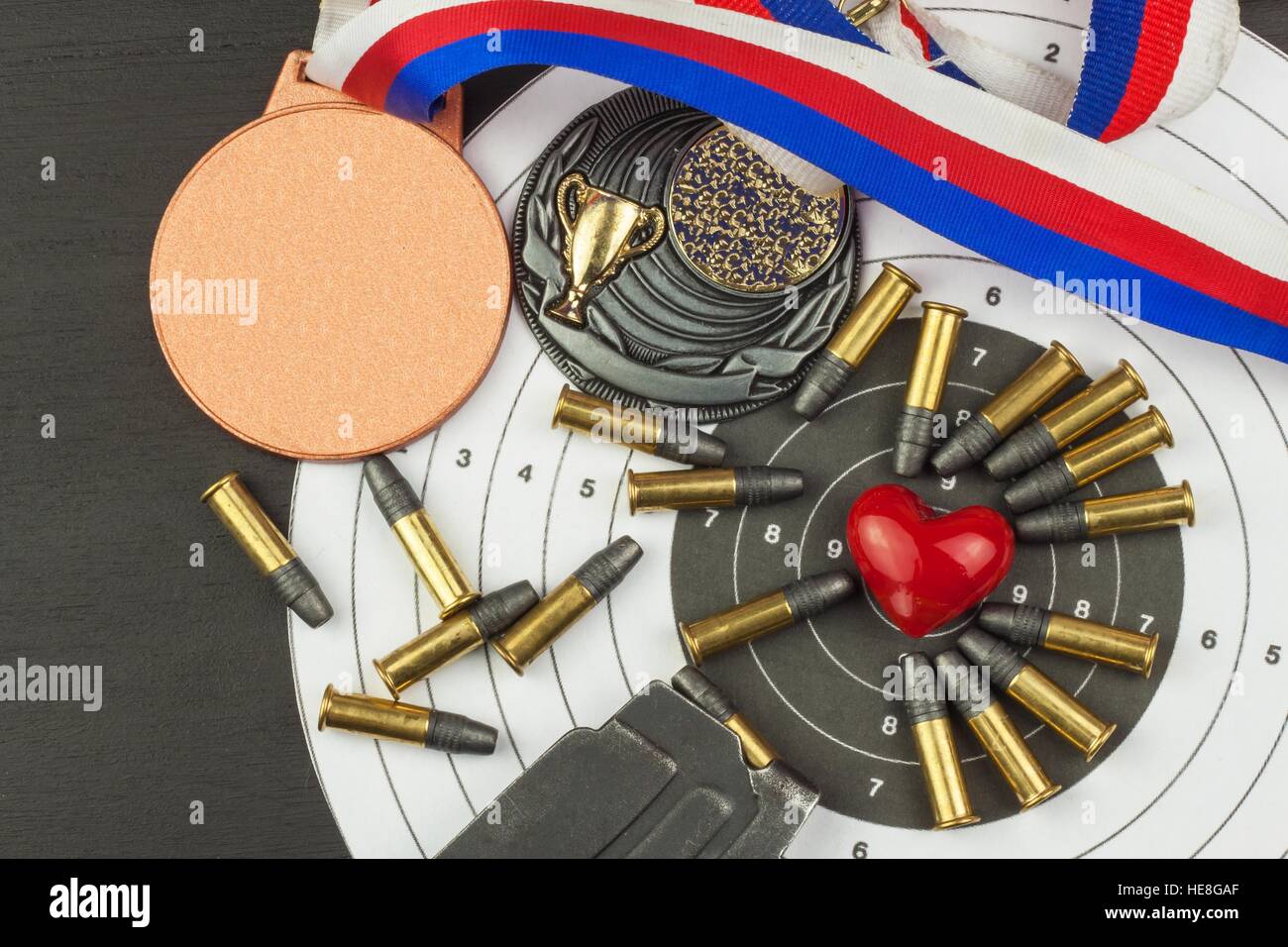Shooting competition. Award winners. Biathlon victory. Ammunition and winners medals in biathlon