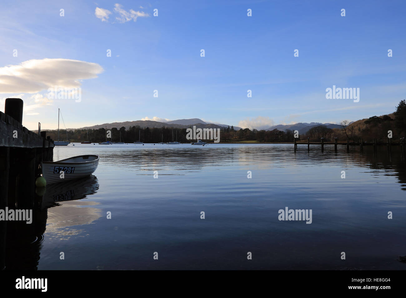 Rowing boat moored to jetty on Lake Windermere, Lake District, Cumbria ...