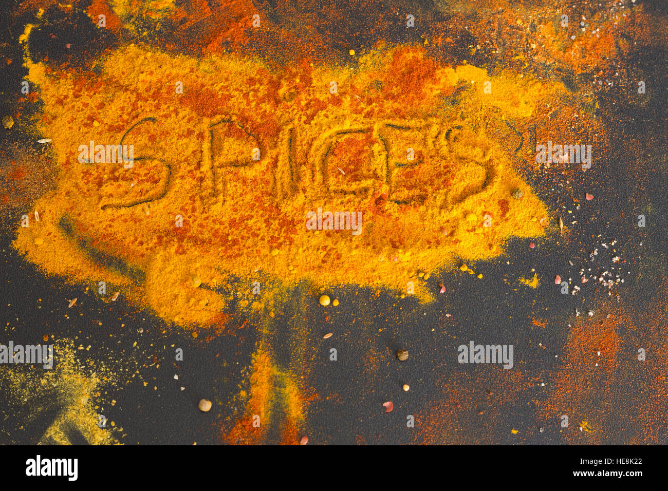 Various spices spoons on stone table Stock Photo