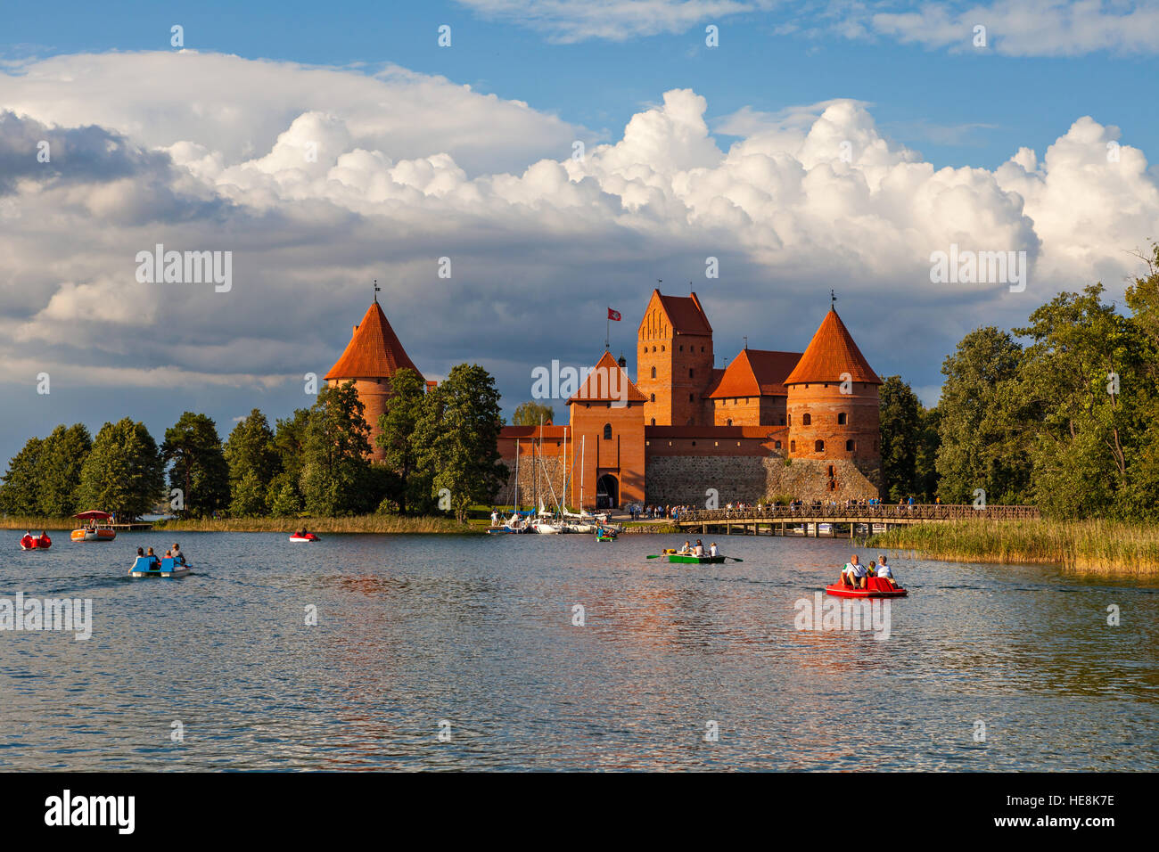TRAKAI, LITHUANIA - AUGUST 15: People boating in the lake Galve in front of Trakai Island Castle Stock Photo