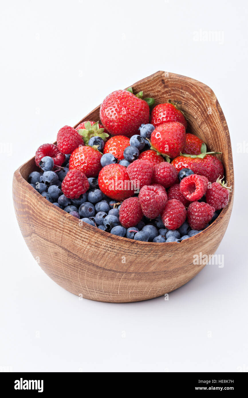 Bowl with fresh berries isolated on white Stock Photo