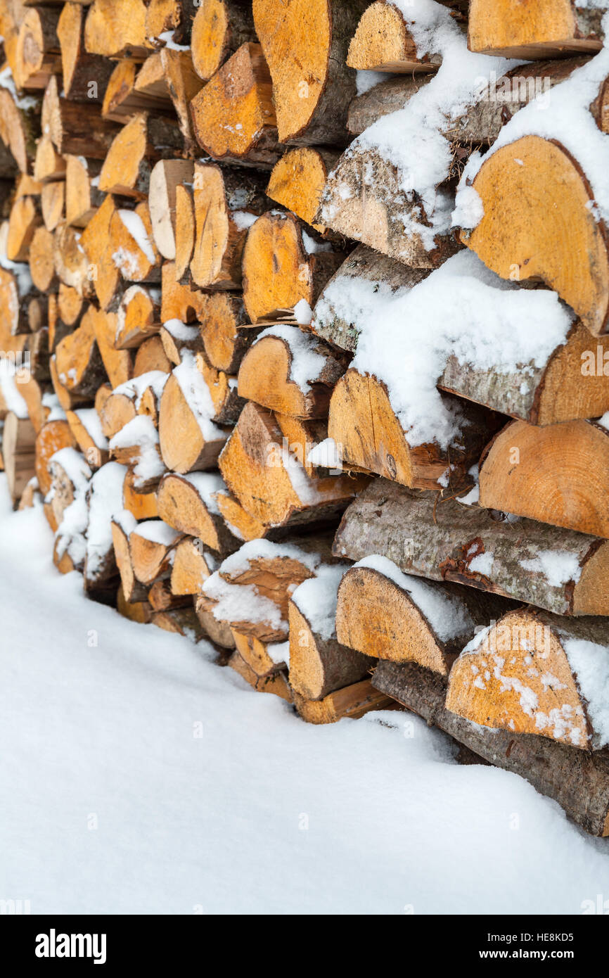 Firewood background - chopped firewood on a stack Stock Photo
