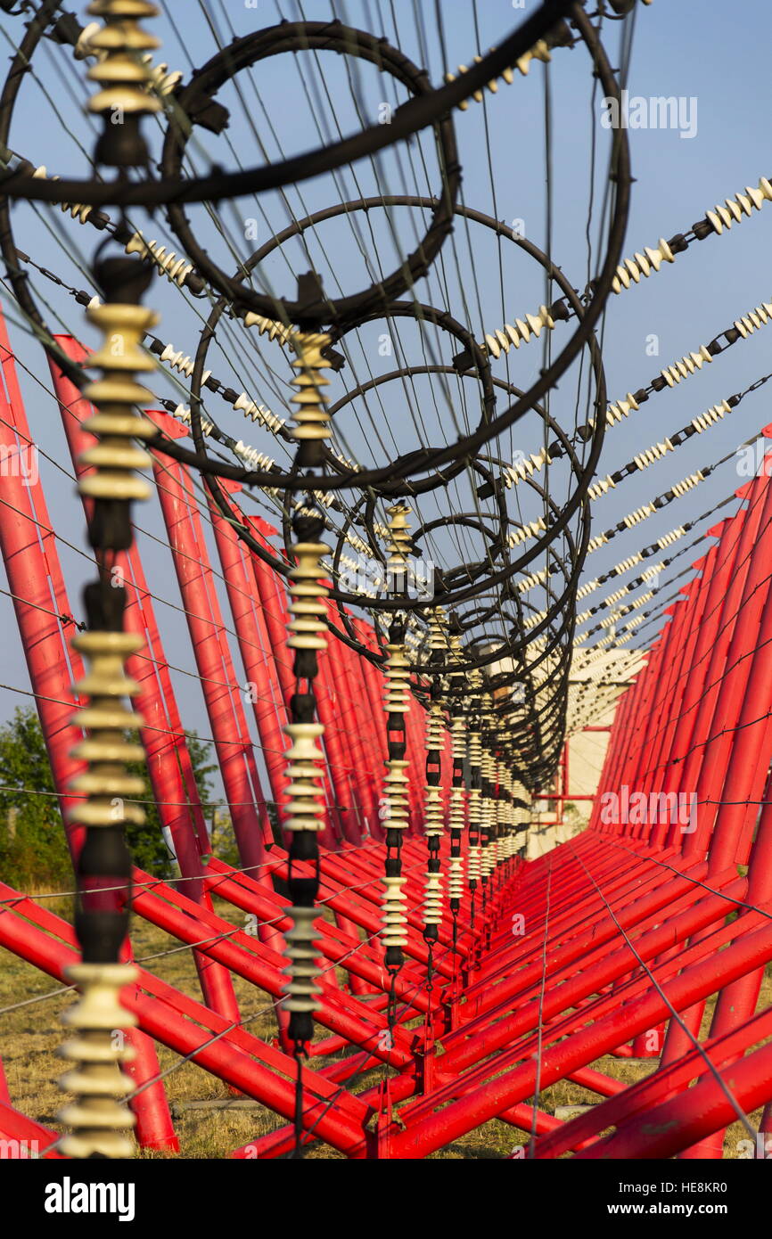 Communication wires lead to switching station from radio transmitter