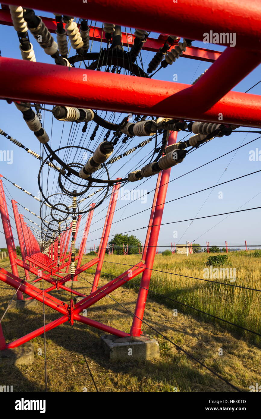 Communication wires lead to switching station from radio transmitter