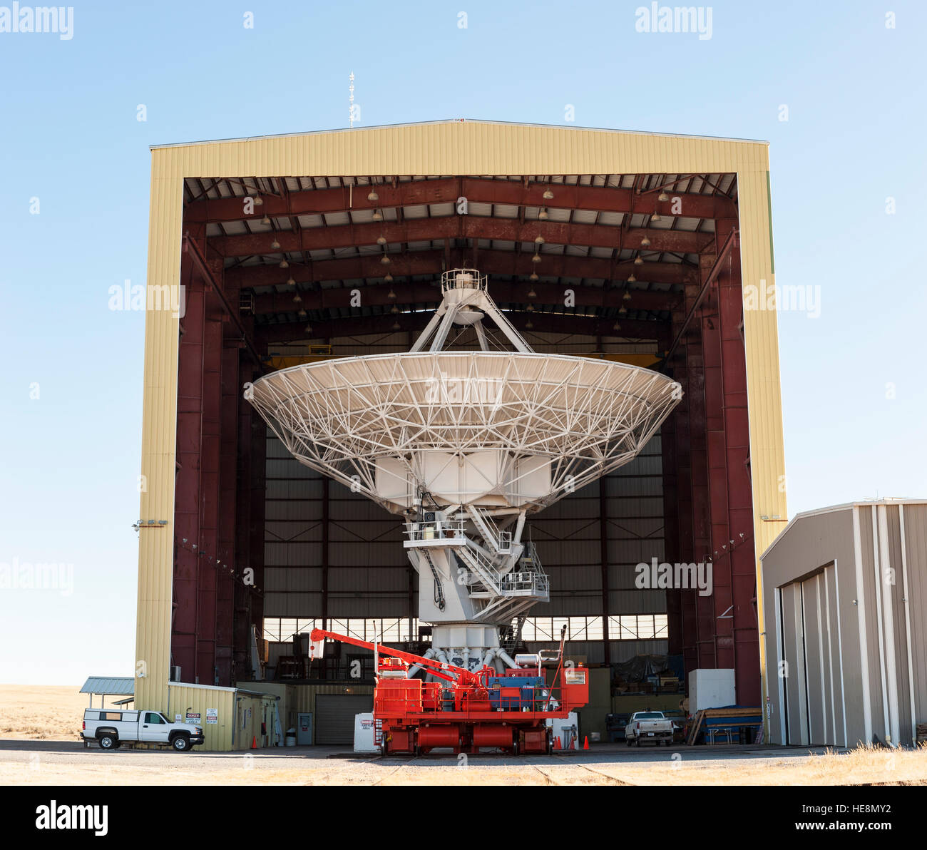 Very Large Array hangar with a radio telescope being repaired / going through maintenance, New Mexico, NM, USA. Stock Photo