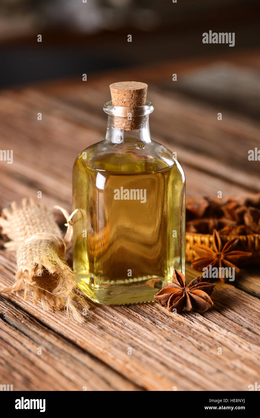 extract star anise in a small glass bottle Stock Photo