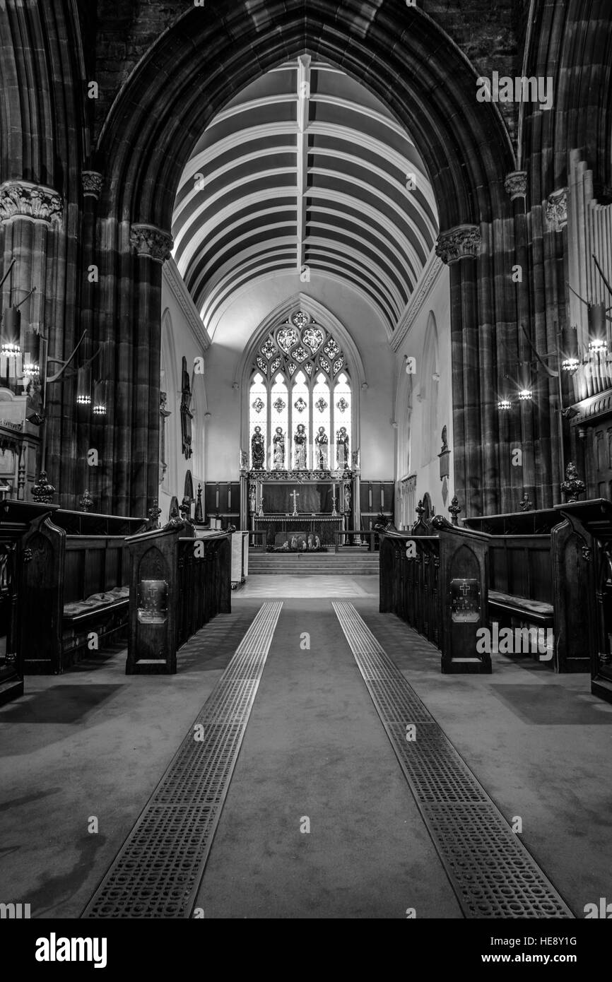 Inside of an old church. arch stone work. stain glass window Stock Photo