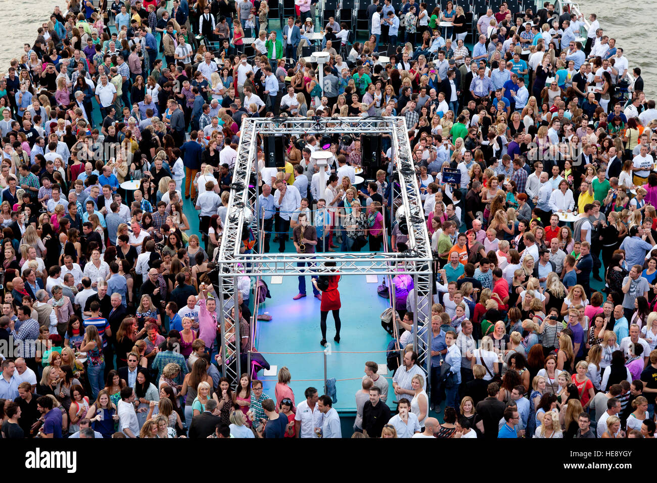Germany, Cologne, people on the event ship RheinEnergie Stock Photo