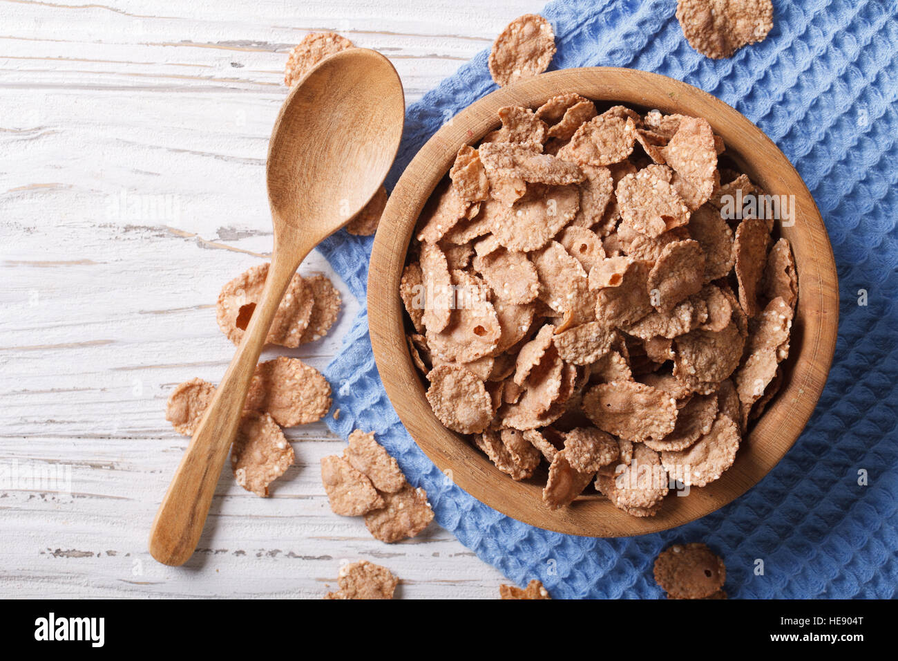 cereal flakes in a wooden bowl. horizontal top view, rustic style Stock Photo