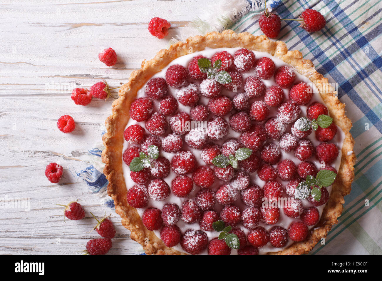 Fresh raspberry tart with cream cheese and mint closeup. horizontal top view Stock Photo