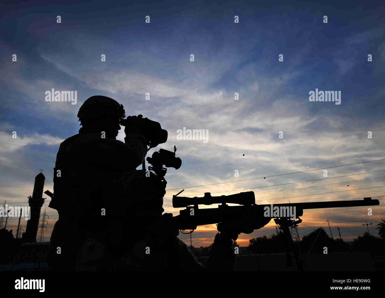 Airmen sharpshooters scan the horizon for possible threats December 2008 in the Al Doura community of southern Baghdad, Iraq. The Airmen are assigned to a close precision engagement team with the 732nd Expeditionary Security Forces Squadron with the 716th Military Police Battalion. (U.S. Navy photo/Petty Officer 2nd Class Todd Frantom) Stock Photo