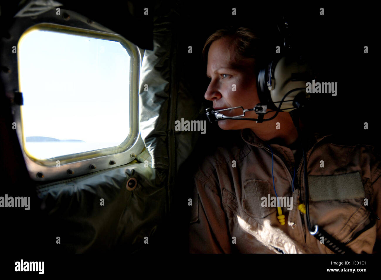 Tech. Sgt. Stacia Zachary, AFCENT combat correspondent, watches the refueling of two U.S. Navy F/A-18 Super Hornets aboard a KC-135 Stratotanker in the skies of Afghanistan, May 12, 2011.  Master Sgt. William Greer) Stock Photo