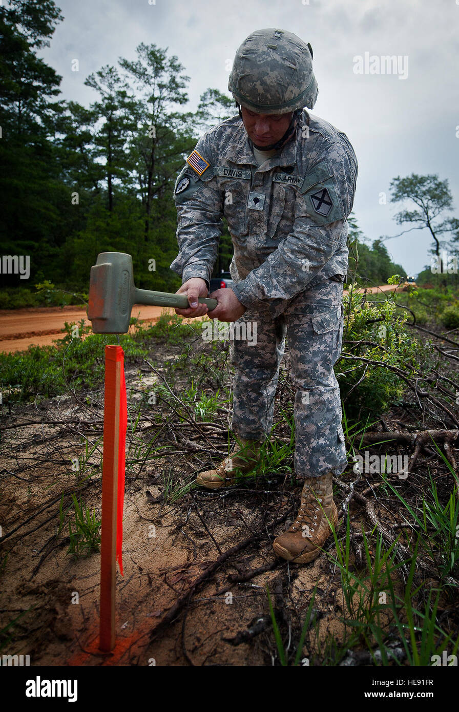 Army personnel from the 1305th Survey and Design Unit widen Range Roads ...