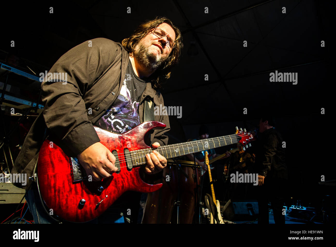 Tommy Denander, guitarist, plays a solo during a performance at Transit