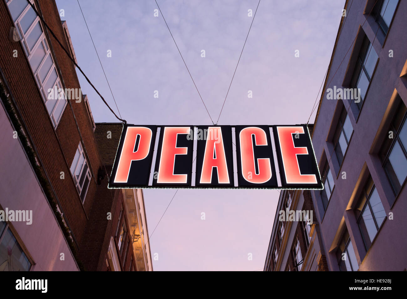 Big Christmas light decoration with words Peace on it in Carnaby street, London. Stock Photo