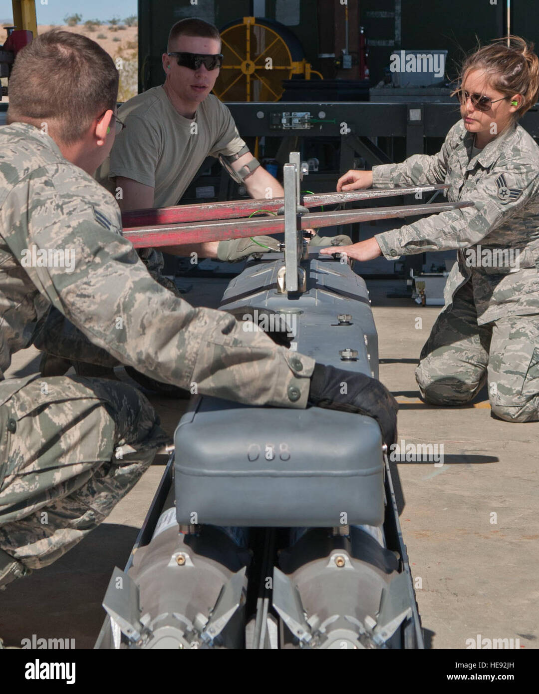 Airmen prepare a BRU-61 bomb rack at the munitions storage area on ...