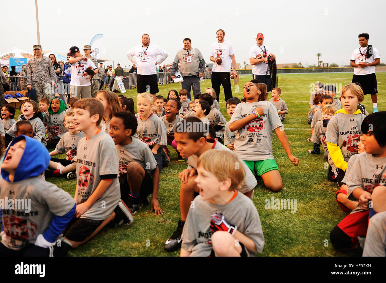 Military Children Yell Out Chants During A Youth Football Camp At Stock Photo Alamy